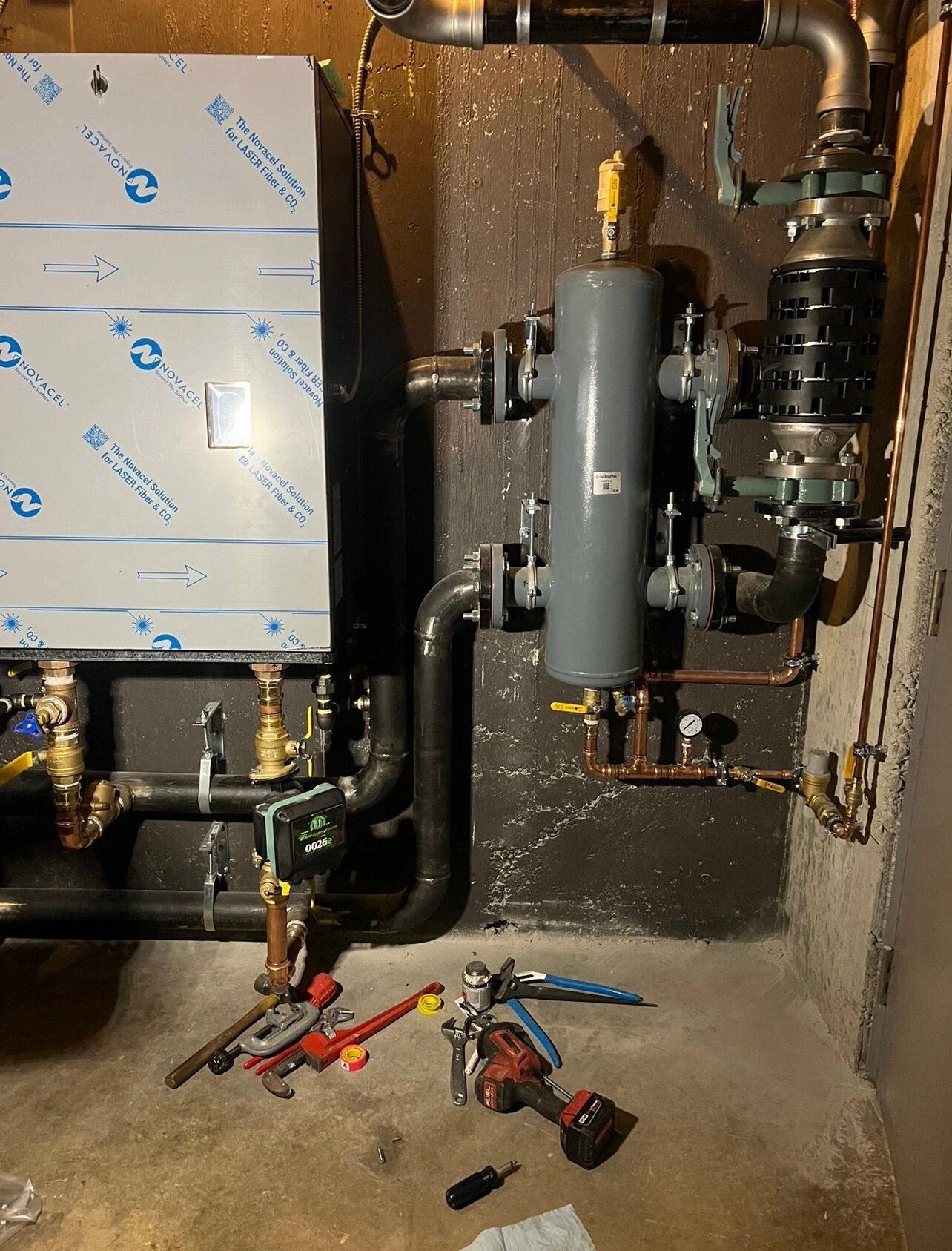 Low loss header and gas piping in a mechanical room