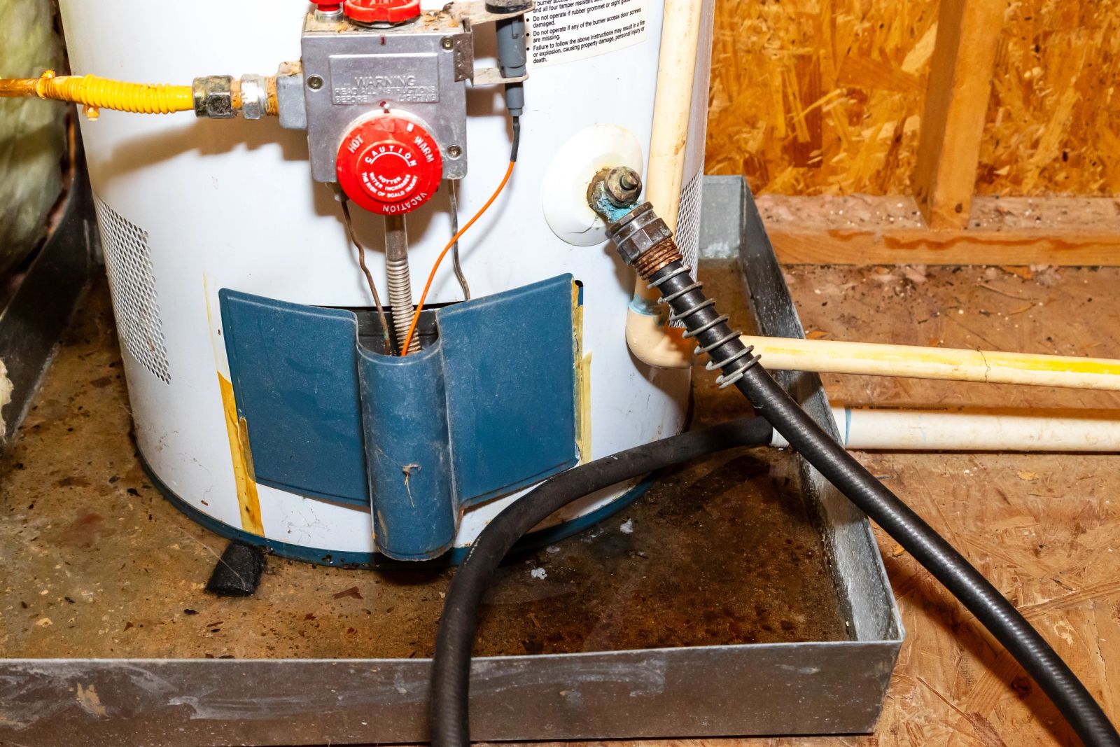 Hot water tank being drained for replacement